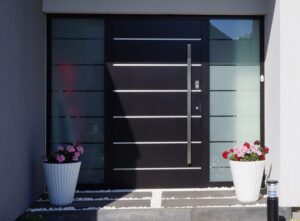 PUERTA DE ALUMINIO DE ENTRADA TONO MADERA